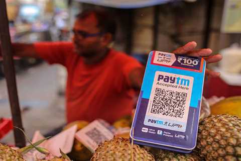 Paytm shares climb after payments giant reports narrower loss