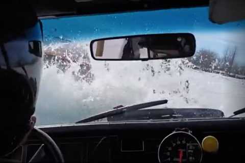 Watch two cars sink in the St. Lawrence River during an ice race