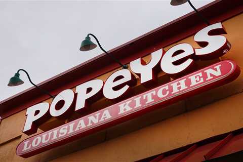 The manager of a Popeyes franchise 'screamed' obscenities at federal investigators and slammed the..
